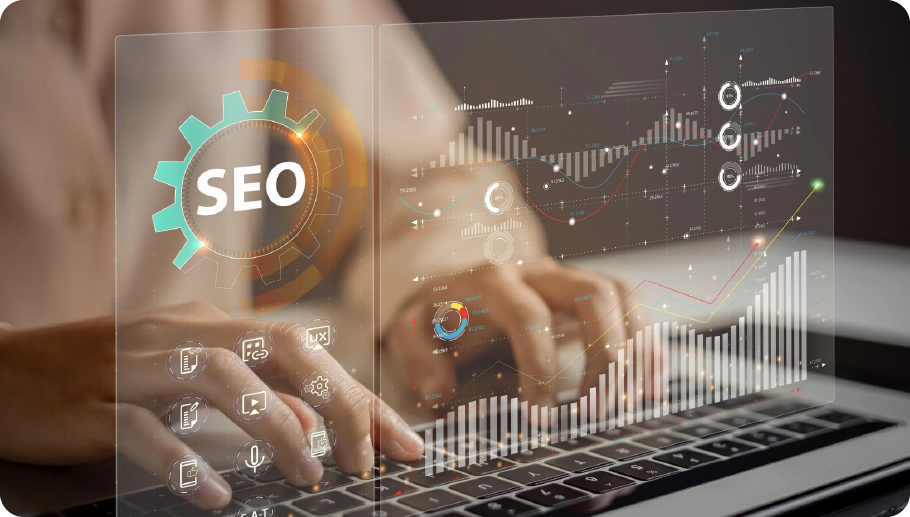A person typing on a laptop with transparent digital graphs and the word “SEO” overlaying the image, representing Search Engine Optimization and digital marketing strategies.